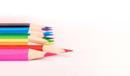 assorted colored pencils used for drawing and coloring on a white background