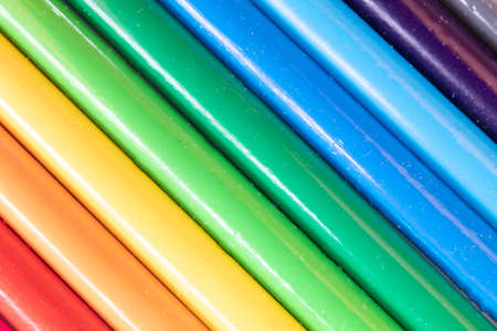 assorted colored pencils used for drawing and coloring on a white background