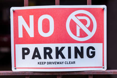 No Parking sign and Symbol on wire gateの写真素材