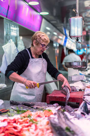 Woman selling fishのeditorial素材