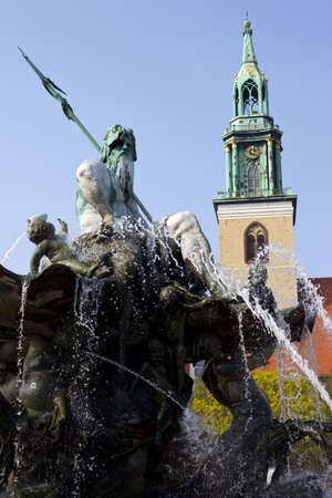 Neptune Fountain & St. Marienkirche in Berlinの写真素材