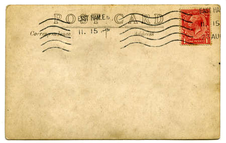 A vintage stamped postcard over a white background.のeditorial素材
