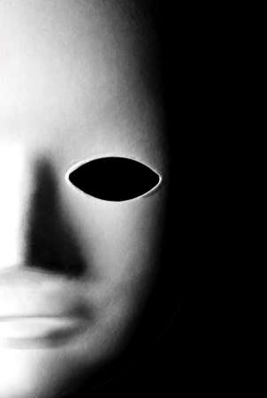 Mask Close-up over a black background.の写真素材
