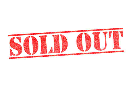 SOLD OUT red rubber stamp over a white background.の写真素材