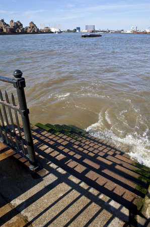 Steps leading down to the River Thames in London.の写真素材