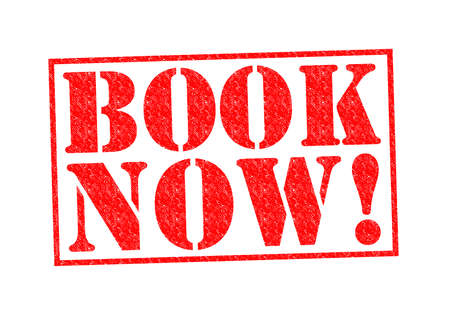 BOOK NOW! Rubber Stamp over a white background.の写真素材