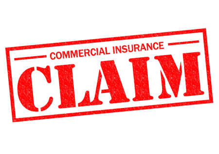 COMMERCIAL INSURANCE CLAIM red Rubber Stamp over a white background.の写真素材