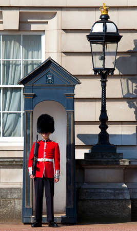 LONDON, UK - MAY 16TH 2014: A Queen's Guard outside the historic Buckingham Palace in London on 16th May 2014.のeditorial素材