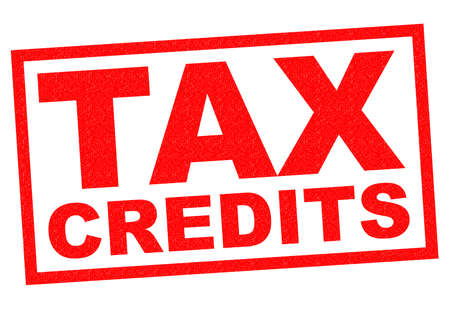 TAX CREDITS red Rubber Stamp over a white background.の写真素材