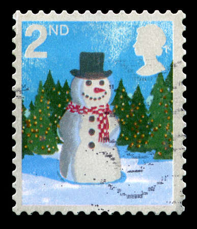 UNITED KINGDOM - CIRCA 2006: A used British postage stamp depicting a Christmas scene, circa 2006.のeditorial素材
