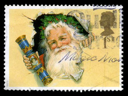 UNITED KINGDOM - CIRCA 1997: A used British postage stamp depicting an image of Santa Claus, circa 1997.のeditorial素材