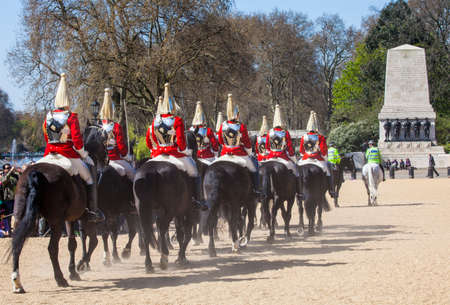 LONDON, UK - APRIL 14TH 2015: Royal Horse Guards travelling through Horseguards Parade after the Changing of the Guard Ceremony in London on 14th April 2015.のeditorial素材