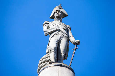Admiral Horatio Nelson sitting proudly ontop of Nelsons Column in Trafalgar Square, London.のeditorial素材