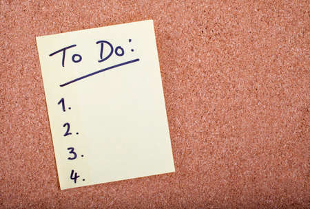 To Do List stuck to a noticeboard.の写真素材