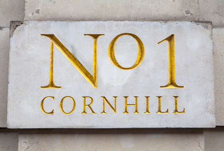 Wall plaque marking Number 1 Cornhill in London.  Cornhill is well-known as one of the historic main...