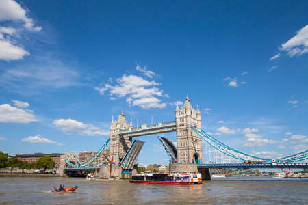 A view of the magnificent Tower Bridge opening up over the River Thames in London.のeditorial素材