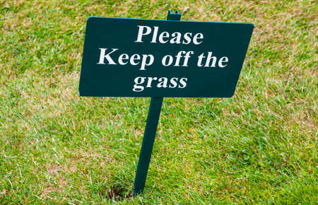 A sign warning people to Keep off of the Grass.の写真素材