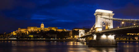 A beautiful dusk-time panoramic view of Buda Castle and the Chain Bridge spanning over the Danube in Budapest, Hungary.のeditorial素材