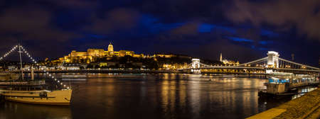 A panorama showing the beautiful Budapest skyline over the River Danube.  The sights include Buda Castle, the Chain Bridge and the Fishermanâs Bastion.のeditorial素材