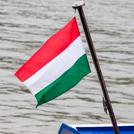 The Hungarian Flag flying on a boat on the Danube.の写真素材