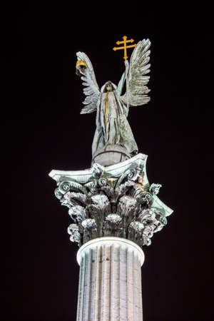 A night-time view of the sculpture on top of the column at Heroes Square in Budapest.のeditorial素材