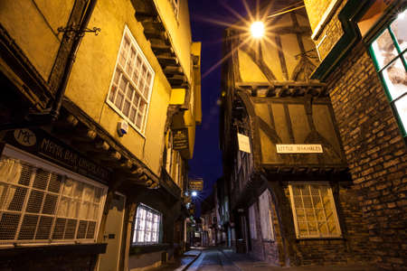 YORK, UK - AUGUST 29TH 2015: A view of the Shambles in York, on 29th August 2015.  It is one of the oldest streets in York with some of the timber-framed buildings dating from the fourteenth century.のeditorial素材