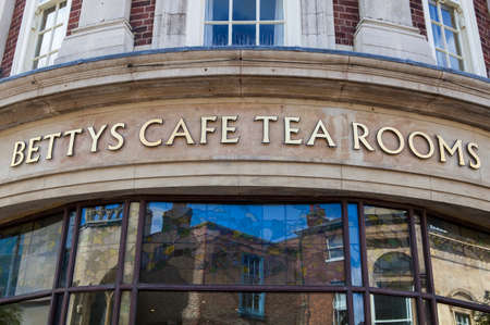 YORK, UK - AUGUST 28TH 2015: A sign for the famous Bettys Tea Rooms in York, on 28th August 2015.