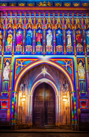 A close-up of the illuminated architecture of Westminster Abbey during the Lumiere London light festival.のeditorial素材