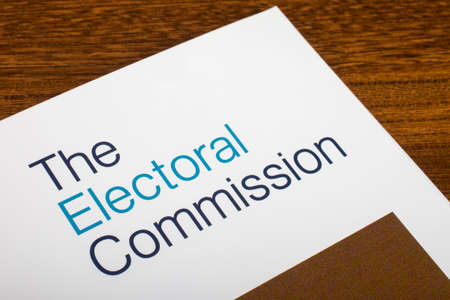 LONDON, UK - JUNE 16TH 2016: The logo of The Electoral Commission on the top of an information booklet, on 16th June 2016.  The organization regulates party and election finances.のeditorial素材