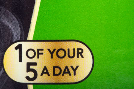 LONDON, UK - JUNE 16TH 2016: A close-up of a sign on a food product informing the consumer that the contents contain 1 of your recommended 5 fruit and vegetable portions a day, on 16th June 2016.のeditorial素材