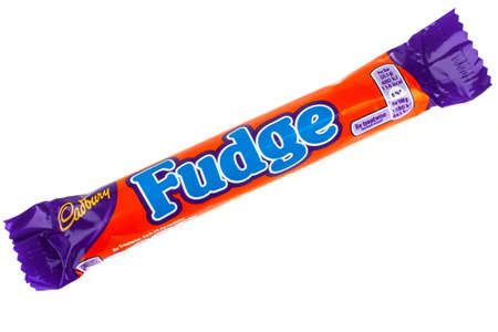 LONDON, UK - JUNE 16TH 2016: An unopened Fudge chocolate bar manufactured by Cadbury, pictured over...
