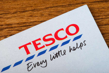 LONDON, UK - JUNE 13TH 2016: A close-up of the Tesco logo and slogan on a promotional leaflet, on 13th June 2016.のeditorial素材