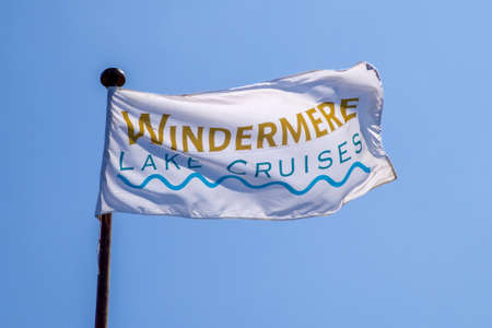 CUMBRIA, UK - MAY 29TH 2016: A flag promoting Lake Cruises on Lake Windermere in the Lake District, on 29th May 2016.のeditorial素材