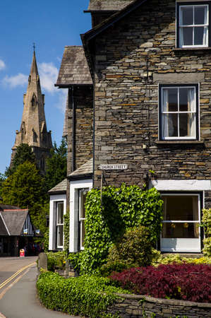 A view of Church Street and St. Marys Church in the distance, in Ambleside, the Lake District.のeditorial素材