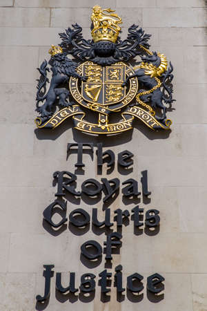 The sign next to the main entrance of the Royal Courts of Justice in central London.のeditorial素材