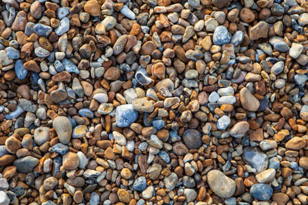 A close-up of the pebbled beach along the Hastings Seafront in Sussex.の写真素材