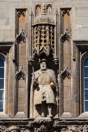 A view of the King Henry VIII statue on the magnificent gatehouse of Trinity College in Cambridge, UK.  King Henry VII founded Trinity College in 1546.のeditorial素材