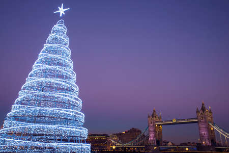 A view of the magnificent Tower Bridge with an illuminated Christmas Tree.のeditorial素材