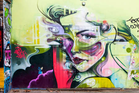 LONDON, UK - JANUARY 13TH 2016: A beautiful piece of urban graffiti portraying a woman, in London on 13th January 2016.のeditorial素材