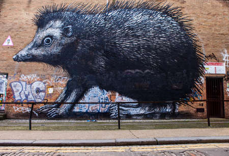 LONDON, UK - JANUARY 13TH 2016: A giant piece of street art by Roa depciting a Hedgehog, in East London on 13th January 2016.のeditorial素材