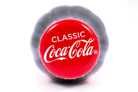 LONDON, UK - JANUARY 4TH 2017: A close-up studio shot of the Classic Coca Cola logo on a bottle top...