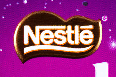 LONDON, UK - JANUARY 4TH 2017: A close-up of the Nestle logo on one of their confectionery products, pictured over a plain white background on 4th January 2017.のeditorial素材