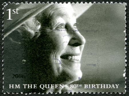 GREAT BRITAIN - CIRCA 2006: A used postage stamp from the UK, celebrating the 80th birthday of Queen Elizabeth II, circa 2006.のeditorial素材