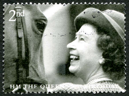 GREAT BRITAIN - CIRCA 2006: A used postage stamp from the UK, celebrating the 80th birthday of Queen Elizabeth II, circa 2006.のeditorial素材