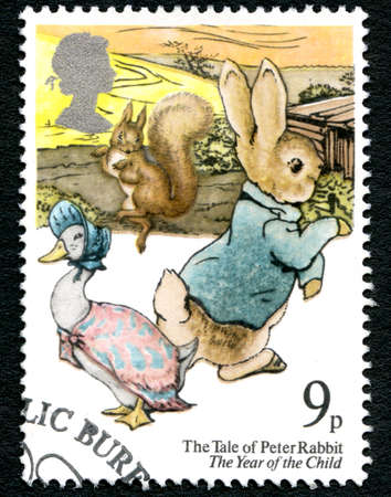 GREAT BRITAIN - CIRCA 1979: A used postage stamp from the UK, depicting an illustration of Peter Rabbit with Jemima Puddle Duck and Squirrel Nutkin, circa 1979.のeditorial素材