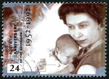 GREAT BRITAIN - CIRCA 1992: A used postage stamp from the UK, commemorating the 40th Anniversary of Queen Elizabeth II accession to the throne, circa 1992.のeditorial素材