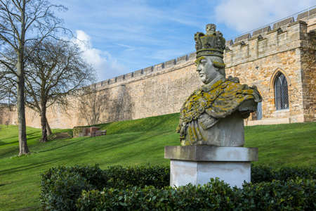 A statue or bust of King George III, in the grounds of the historic Lincoln Castle in the city of Lincoln, UK.のeditorial素材