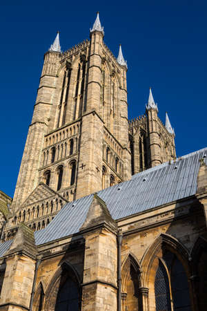 A view of the western towers of Lincoln Cathedral in the historic city of Lincoln, UK.の写真素材