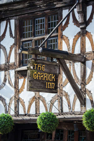 STRATFORD-UPON-AVON, UK - MARCH 2ND 2017: The sign above the main entrance to the Garrick Inn Public House in Stratford-Upon-Avon, on 2nd March 2017.  It is reputedly the oldest pub in the town.のeditorial素材