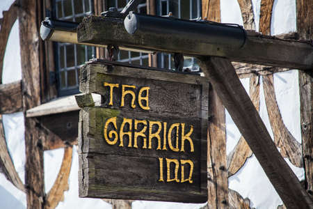 STRATFORD-UPON-AVON, UK - MARCH 2ND 2017: The sign above the main entrance to the Garrick Inn Public House in Stratford-Upon-Avon, on 2nd March 2017.  It is reputedly the oldest pub in the town.のeditorial素材